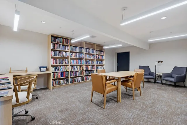 a view of a chair and table in the garden