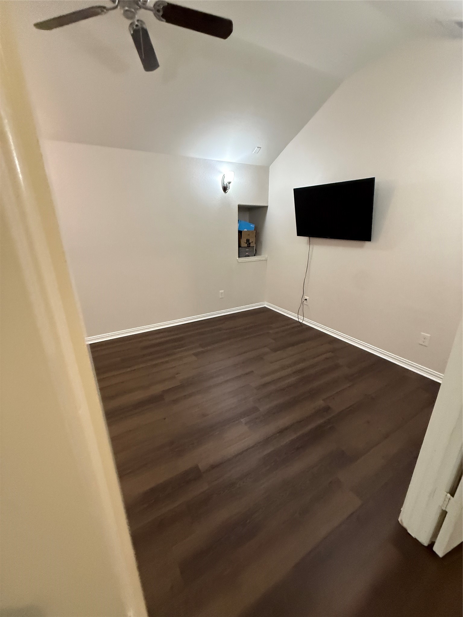 20206 Lago Bluff Loop Cypress, TX 77433 - Photo 12 of 16 a view of an empty room with wooden floor