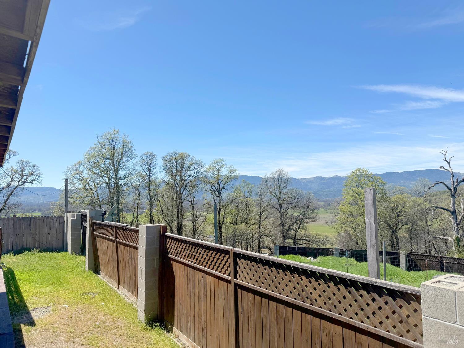 27150 Mendocino Pass Road Covelo, CA 95428 - Photo 27 of 32 a view of a balcony with mountain view and a garden