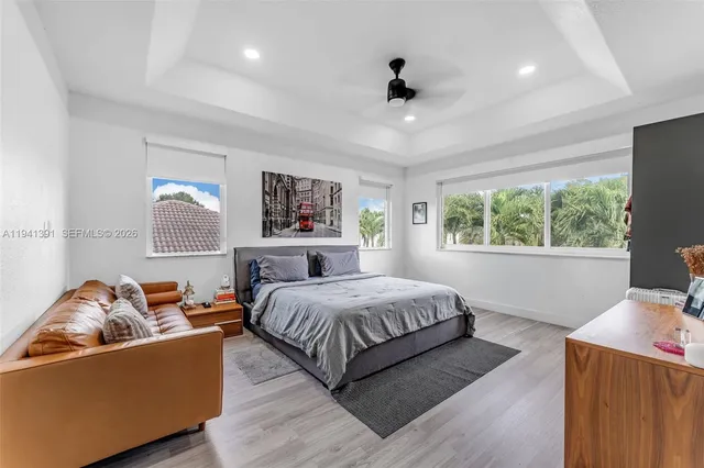 a bedroom with a large bed and a couch