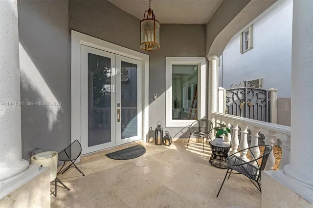 a bedroom with furniture and a window