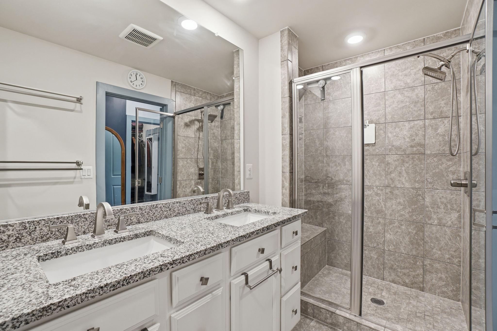 12916 Sunrise Ridge Alley, Unit 63 Herndon, VA 20171 - Photo 17 of 71 Full bathroom with dual sinks and shower with seat