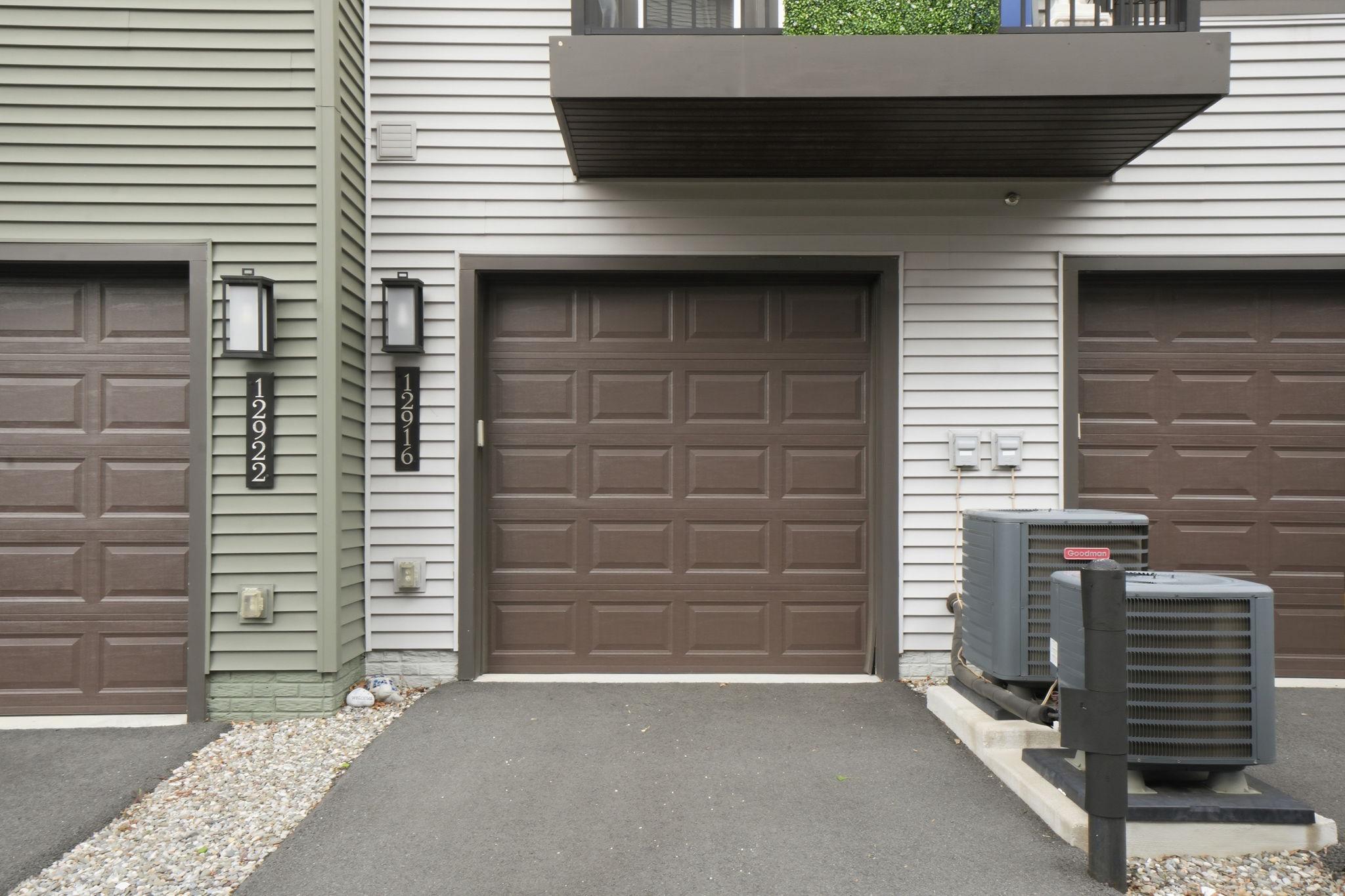 12916 Sunrise Ridge Alley, Unit 63 Herndon, VA 20171 - Photo 31 of 71 Modern garage entrance with sleek design.