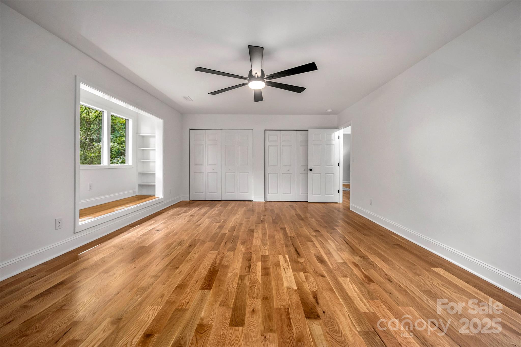 160 Lasae Lane Tryon, NC 28782 - Photo 17 of 48 a view of empty room with wooden floor and fan