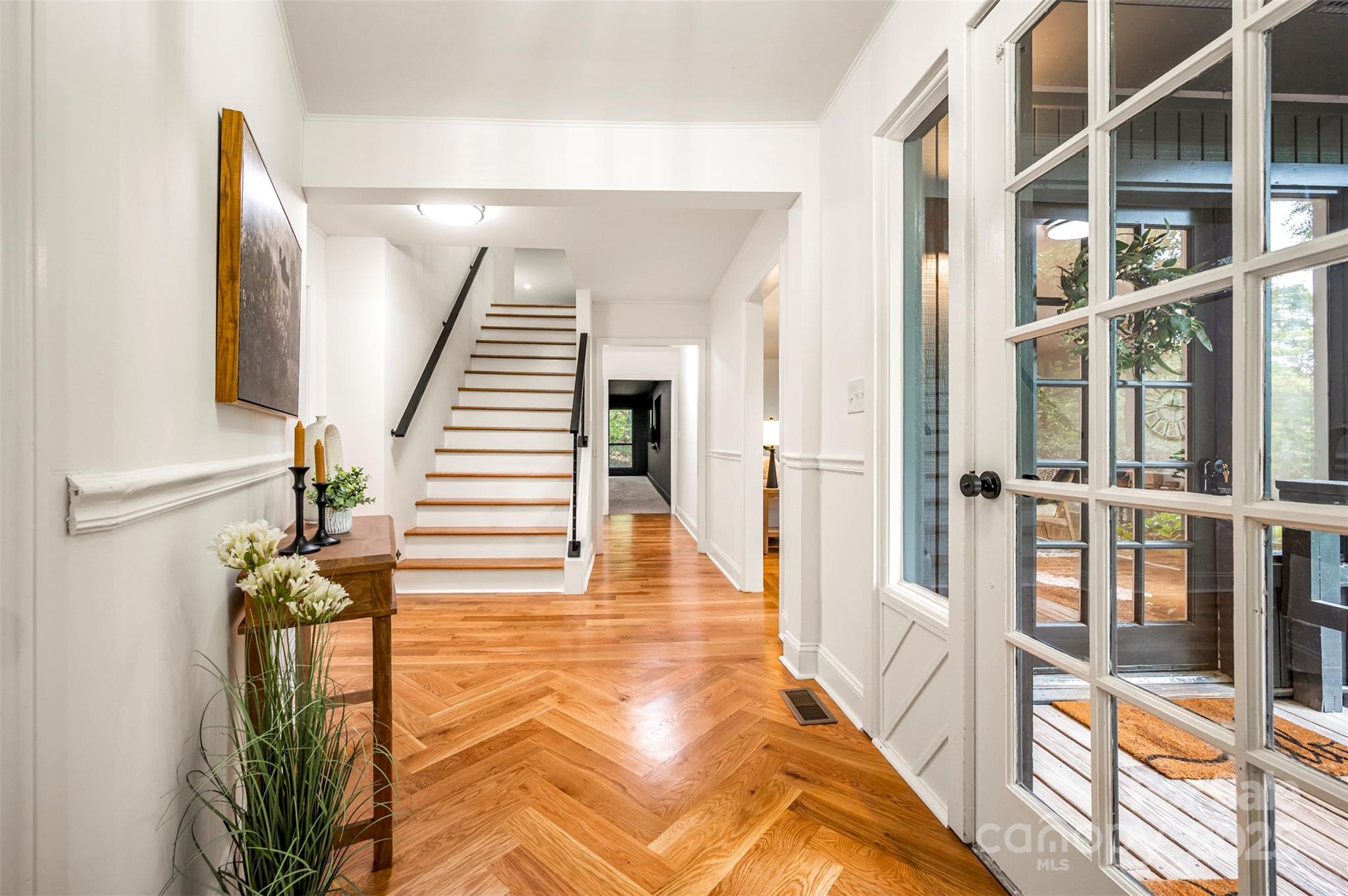 160 Lasae Lane Tryon, NC 28782 - Photo 22 of 48 a view of a hallway with wooden floor and staircase