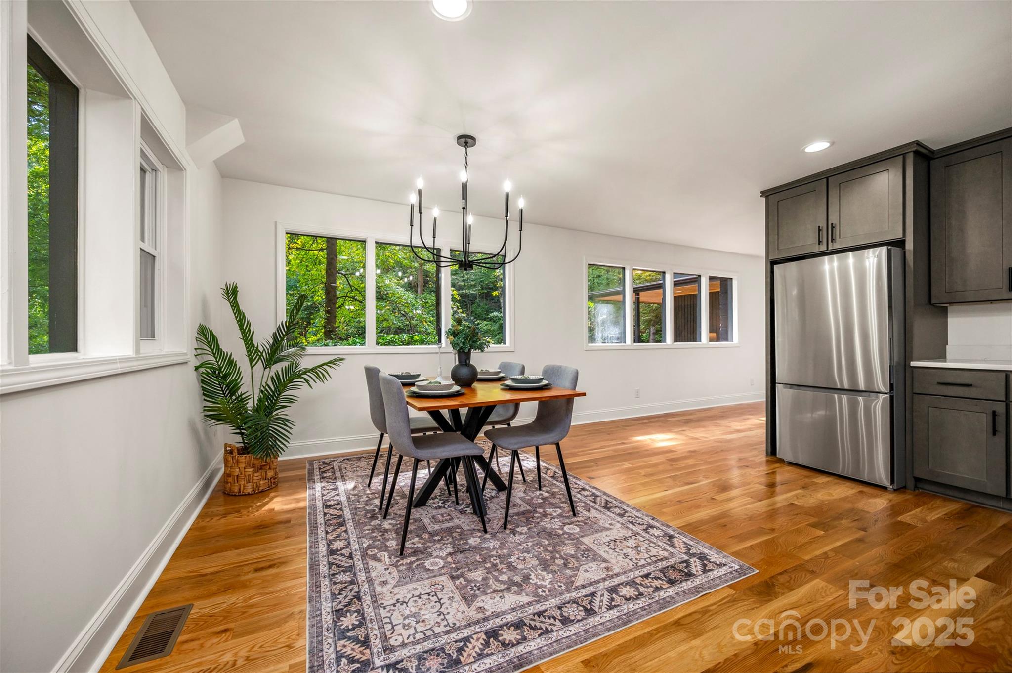 160 Lasae Lane Tryon, NC 28782 - Photo 25 of 48 a view of a dining room with furniture window and wooden floor