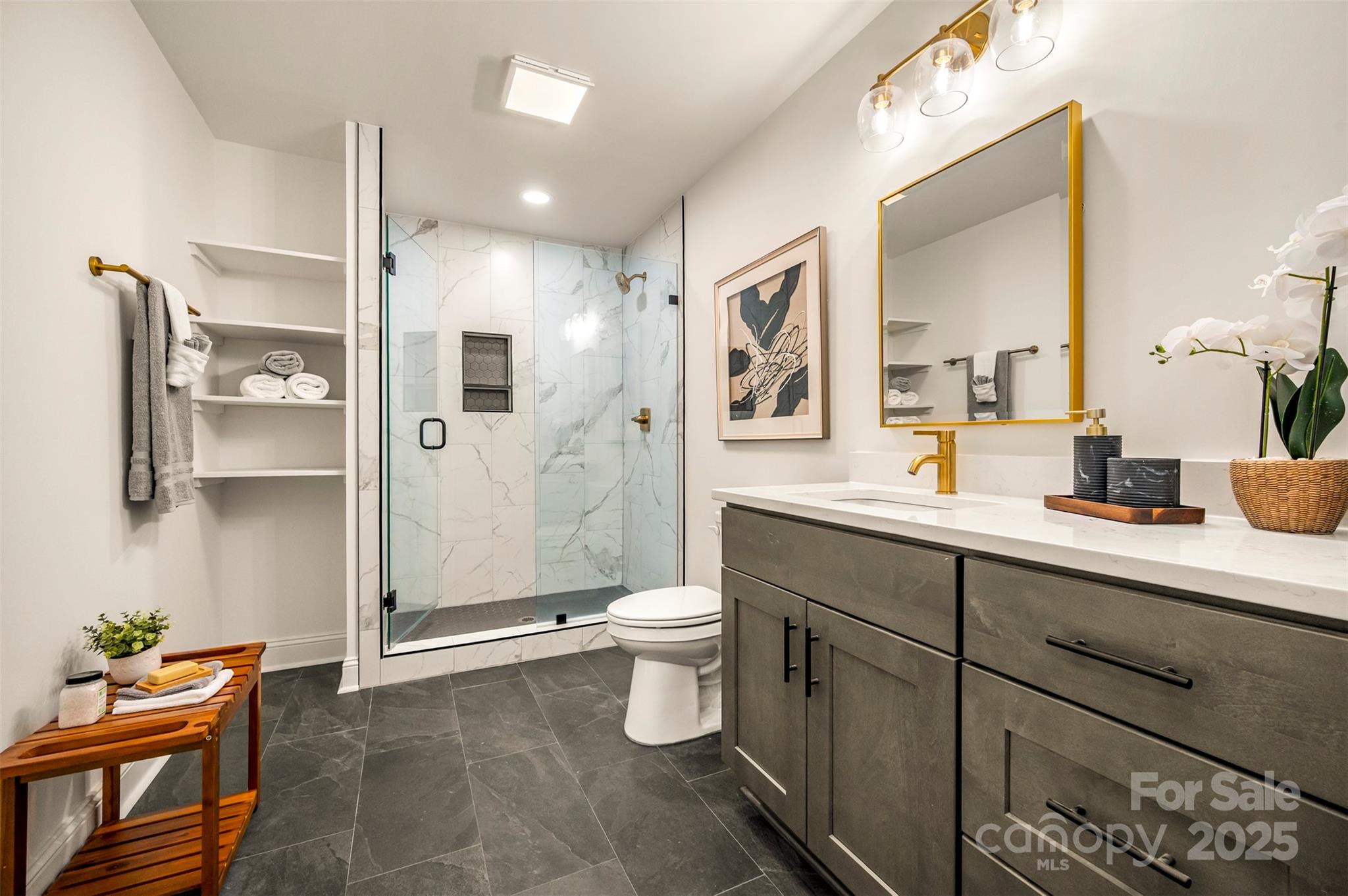 160 Lasae Lane Tryon, NC 28782 - Photo 27 of 48 a spacious bathroom with a double vanity sink toilet and shower