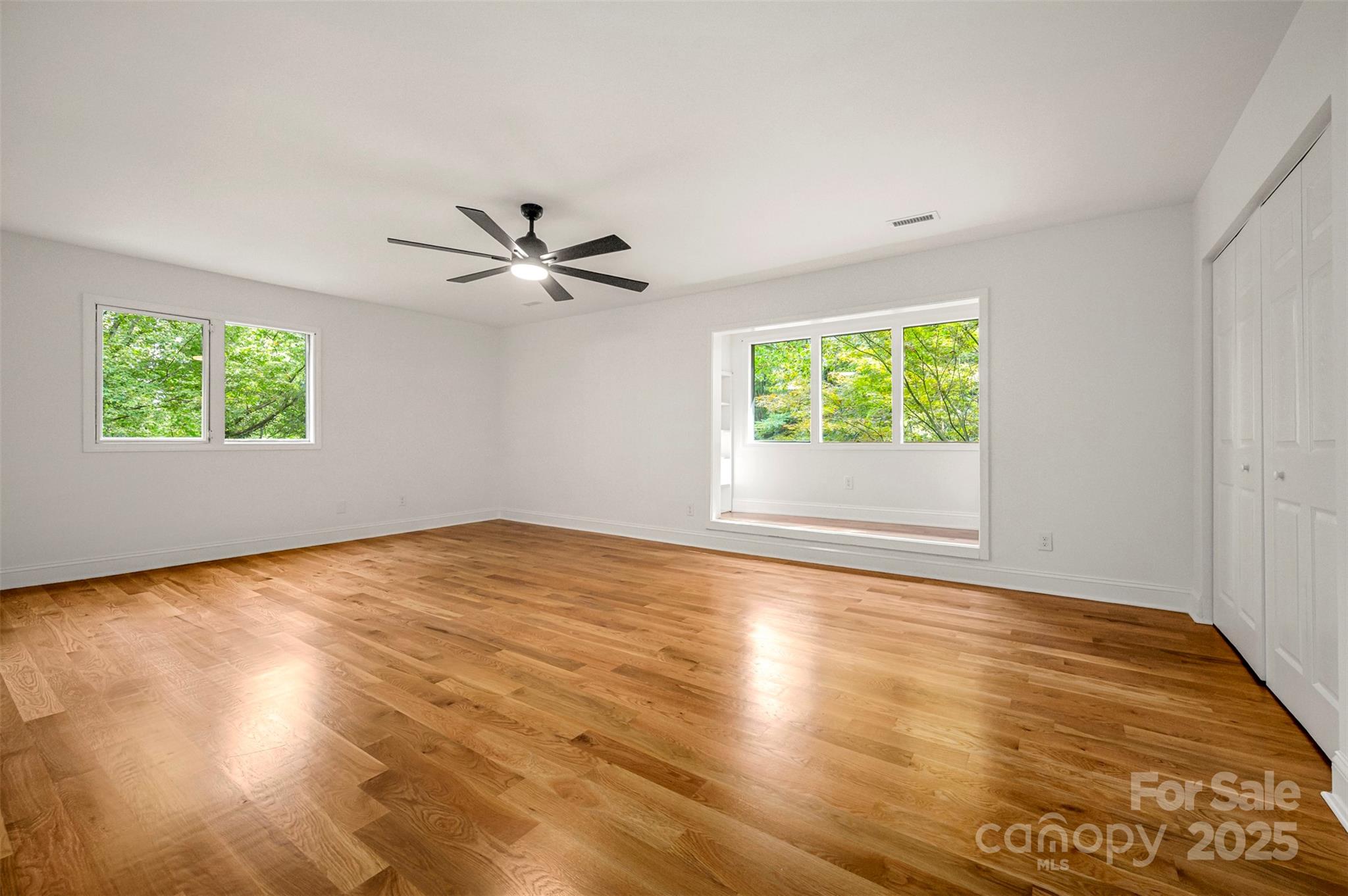 160 Lasae Lane Tryon, NC 28782 - Photo 28 of 48 an empty room with window and windows