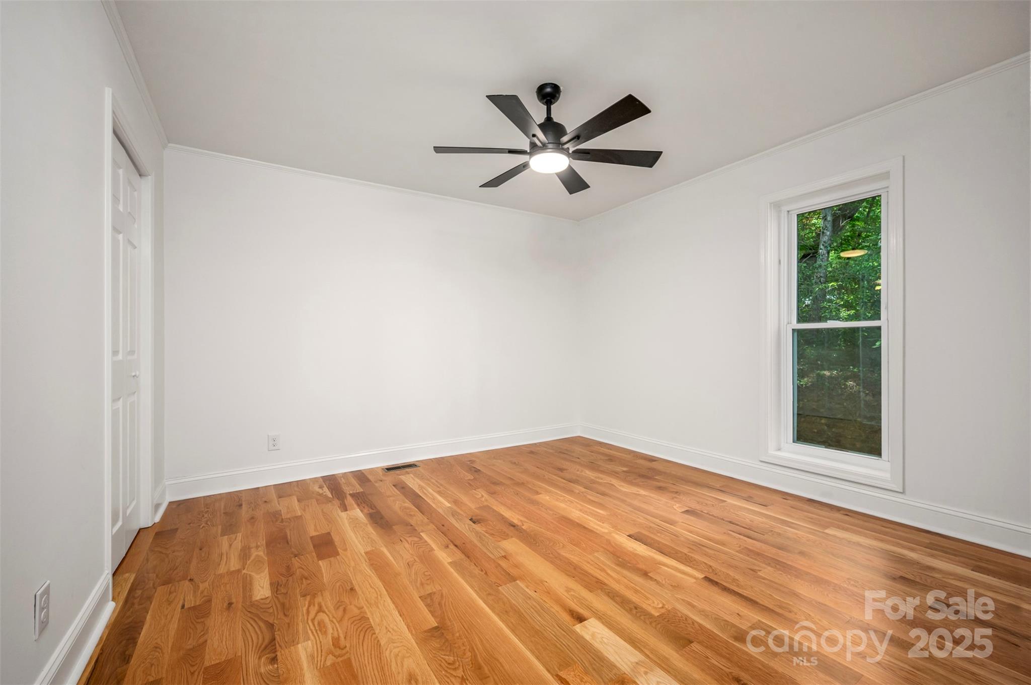 160 Lasae Lane Tryon, NC 28782 - Photo 32 of 48 a view of empty room with wooden floor and fan
