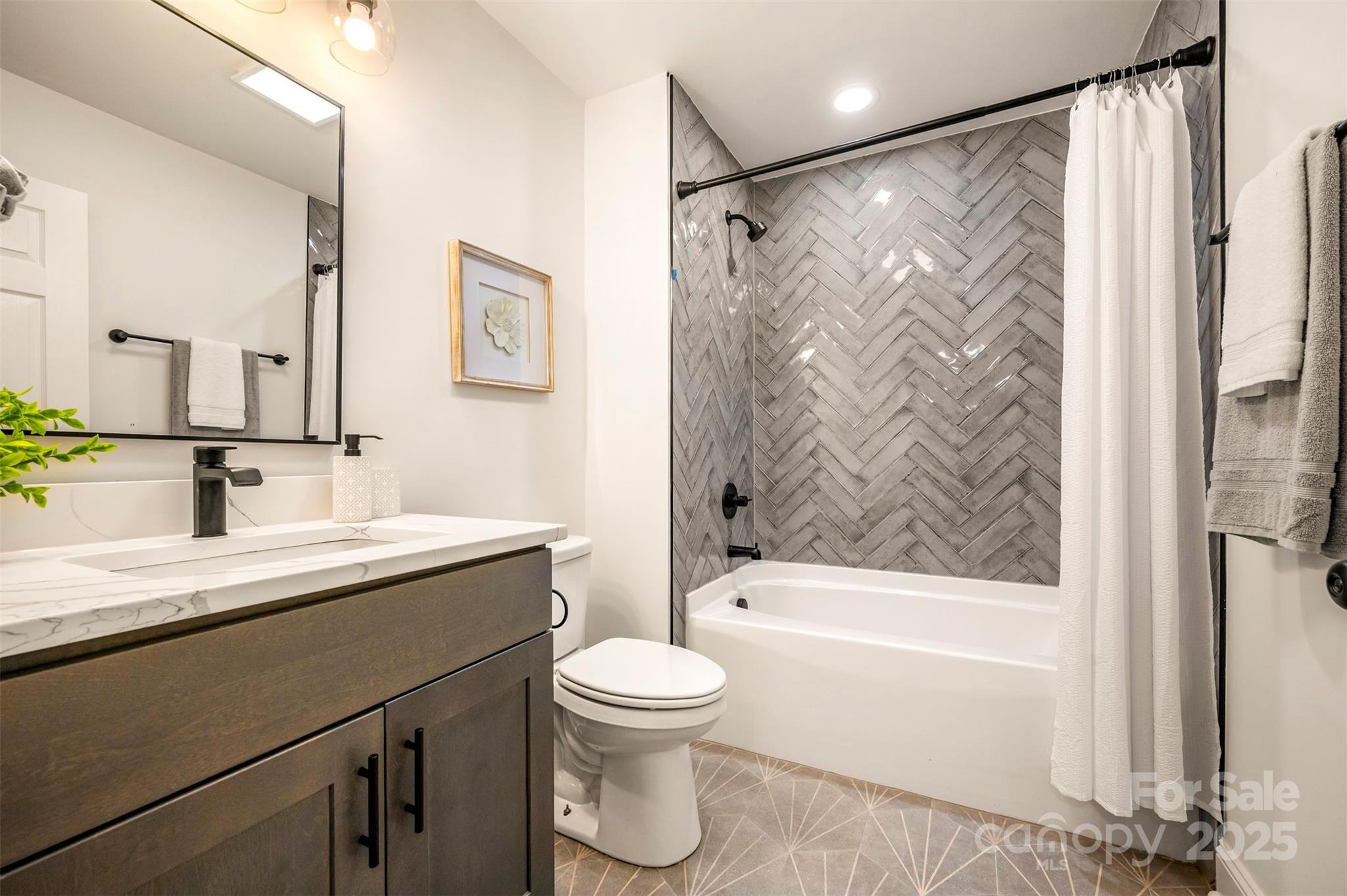 160 Lasae Lane Tryon, NC 28782 - Photo 34 of 48 a bathroom with a granite countertop sink toilet a shower and a mirror