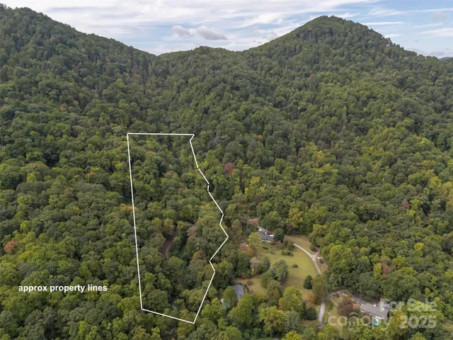a aerial view of a house with a yard