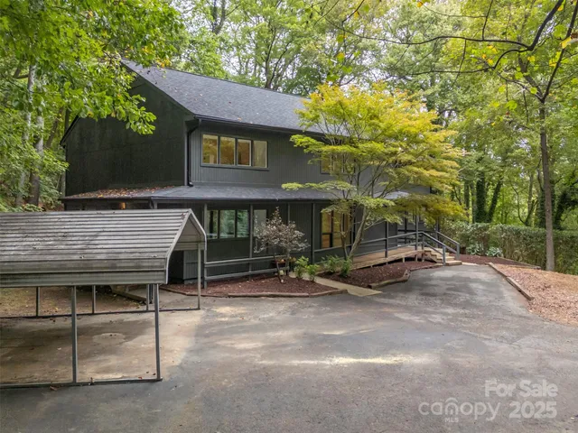 an outdoor space with patio and sitting area