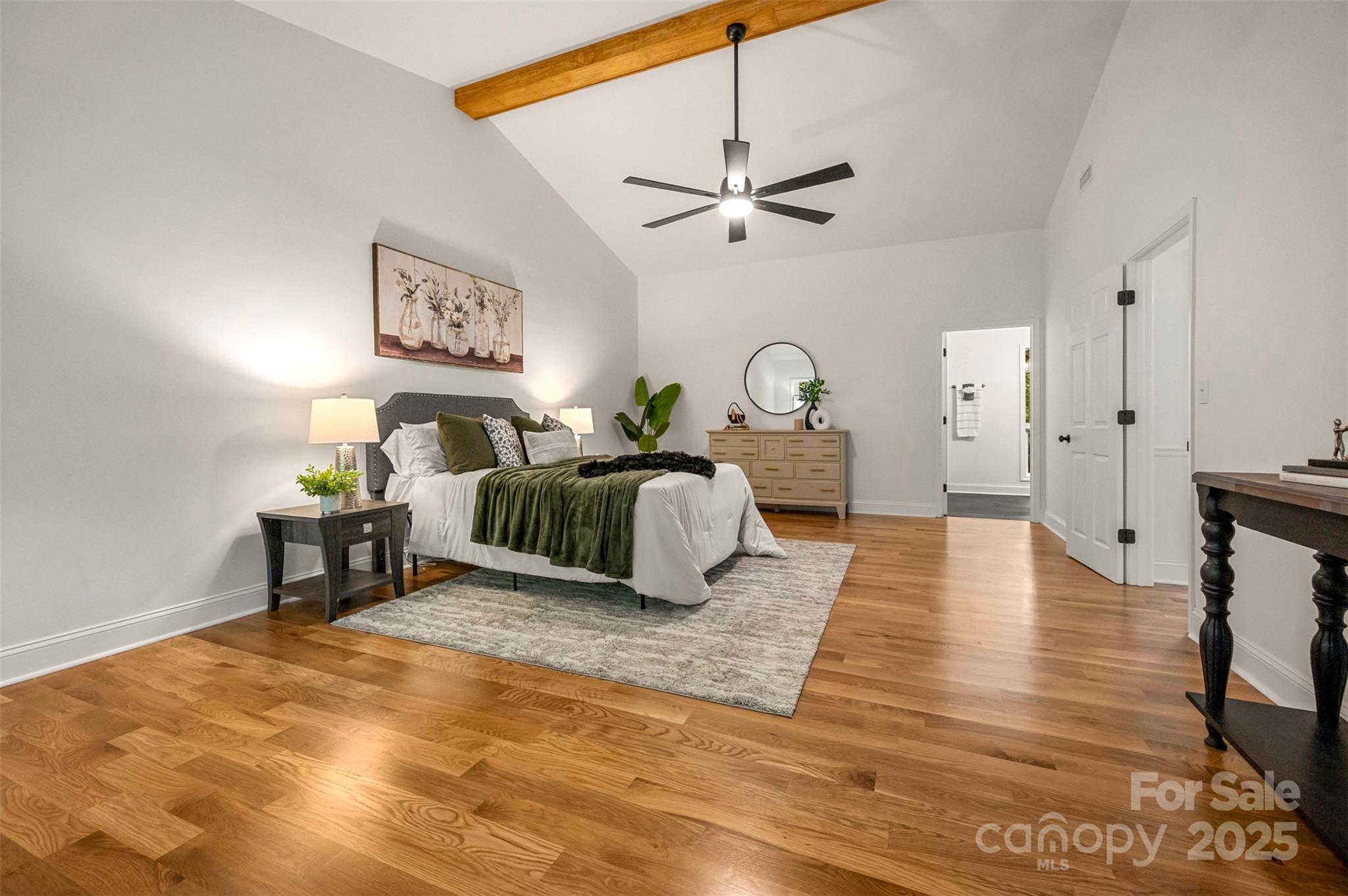 160 Lasae Lane Tryon, NC 28782 - Photo 9 of 48 a bedroom with a bed and wooden floor