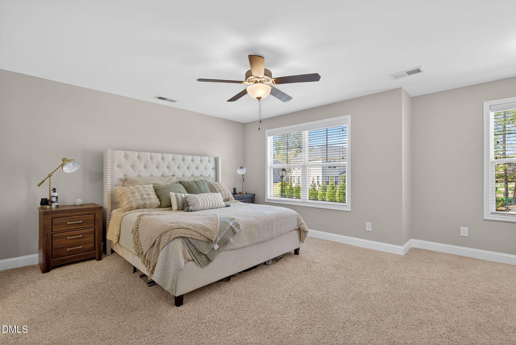 164 East Ravano Drive Clayton, NC 27527 - Photo 20 of 30 a bedroom with a bed dresser and a window