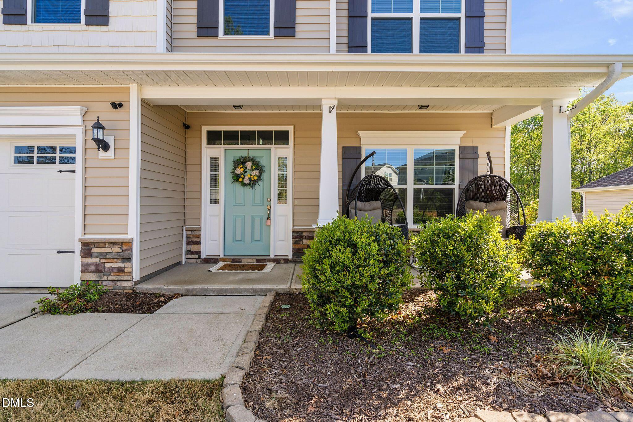 164 East Ravano Drive Clayton, NC 27527 - Photo 2 of 30 a view of a house with potted plants