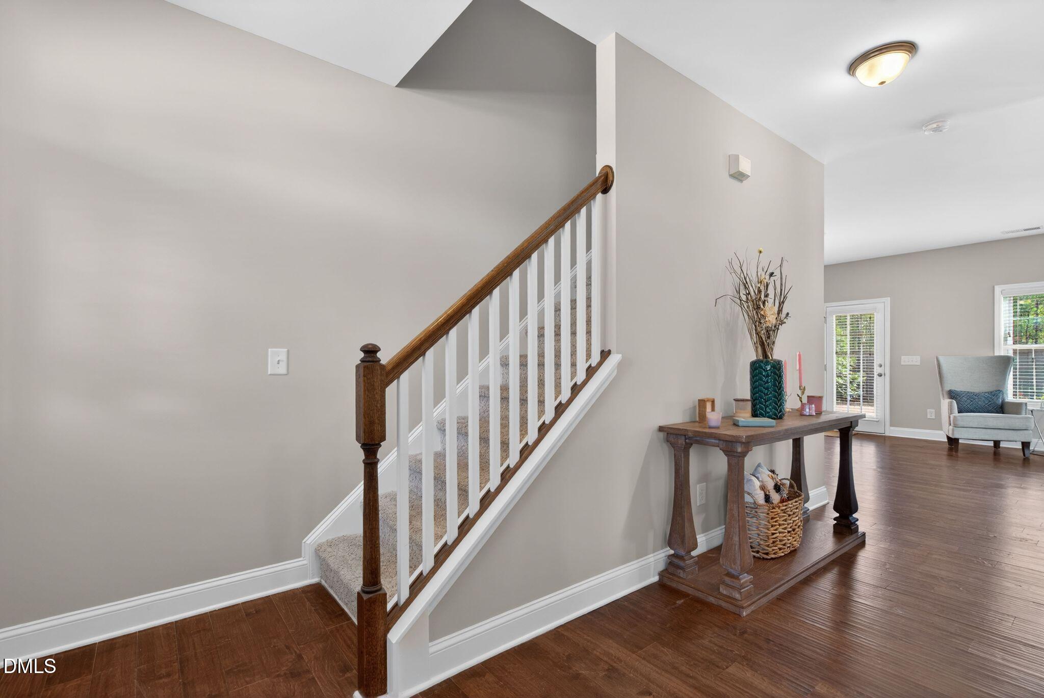 164 East Ravano Drive Clayton, NC 27527 - Photo 5 of 30 a view of a livingroom with wooden floor and stairs