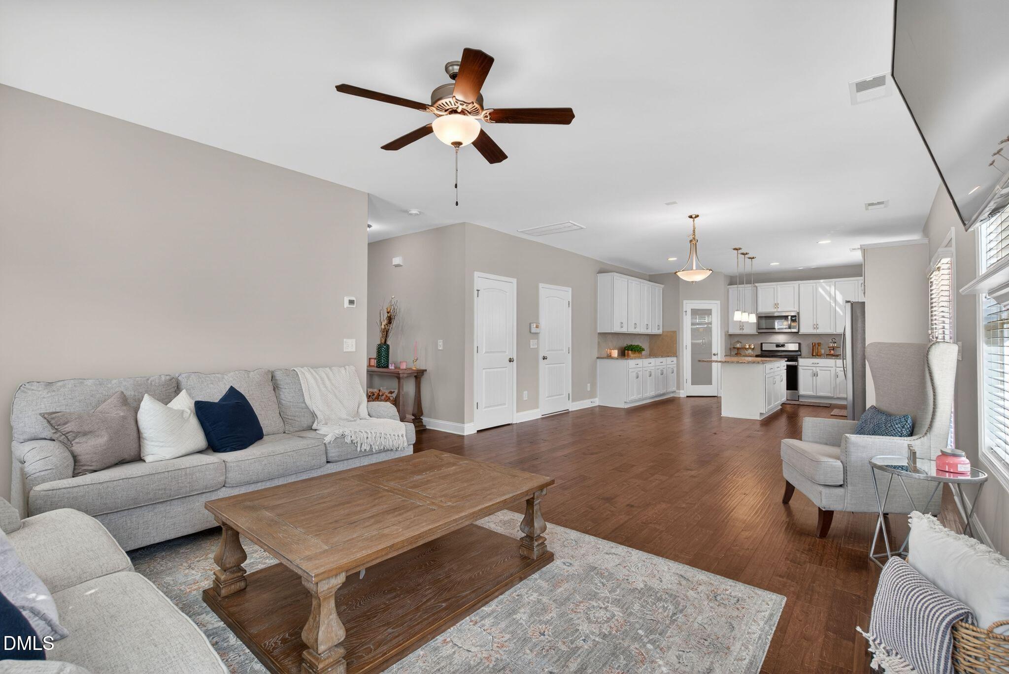 164 East Ravano Drive Clayton, NC 27527 - Photo 10 of 30 a living room with furniture and a view of kitchen