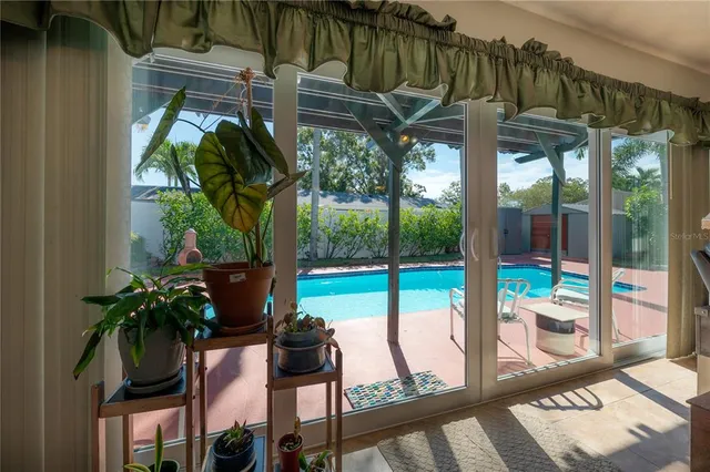 a view of a backyard with sitting area