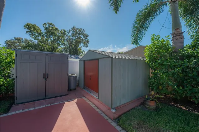 a view of a backyard with swimming pool
