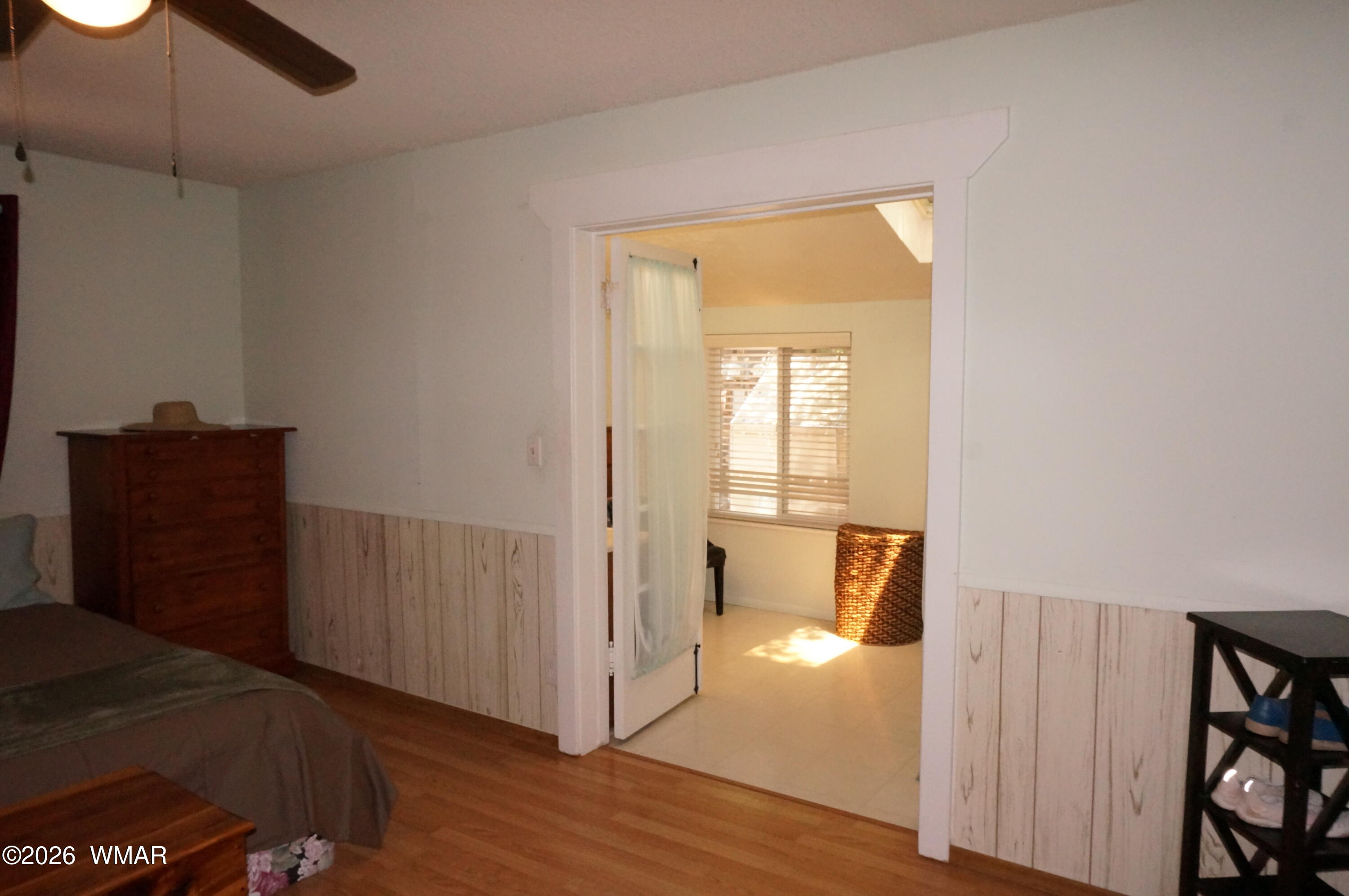 6066 Wagon Wheel Road Lakeside, AZ 85929 - Photo 14 of 32 a view of a hallway with wooden floor and cabinet