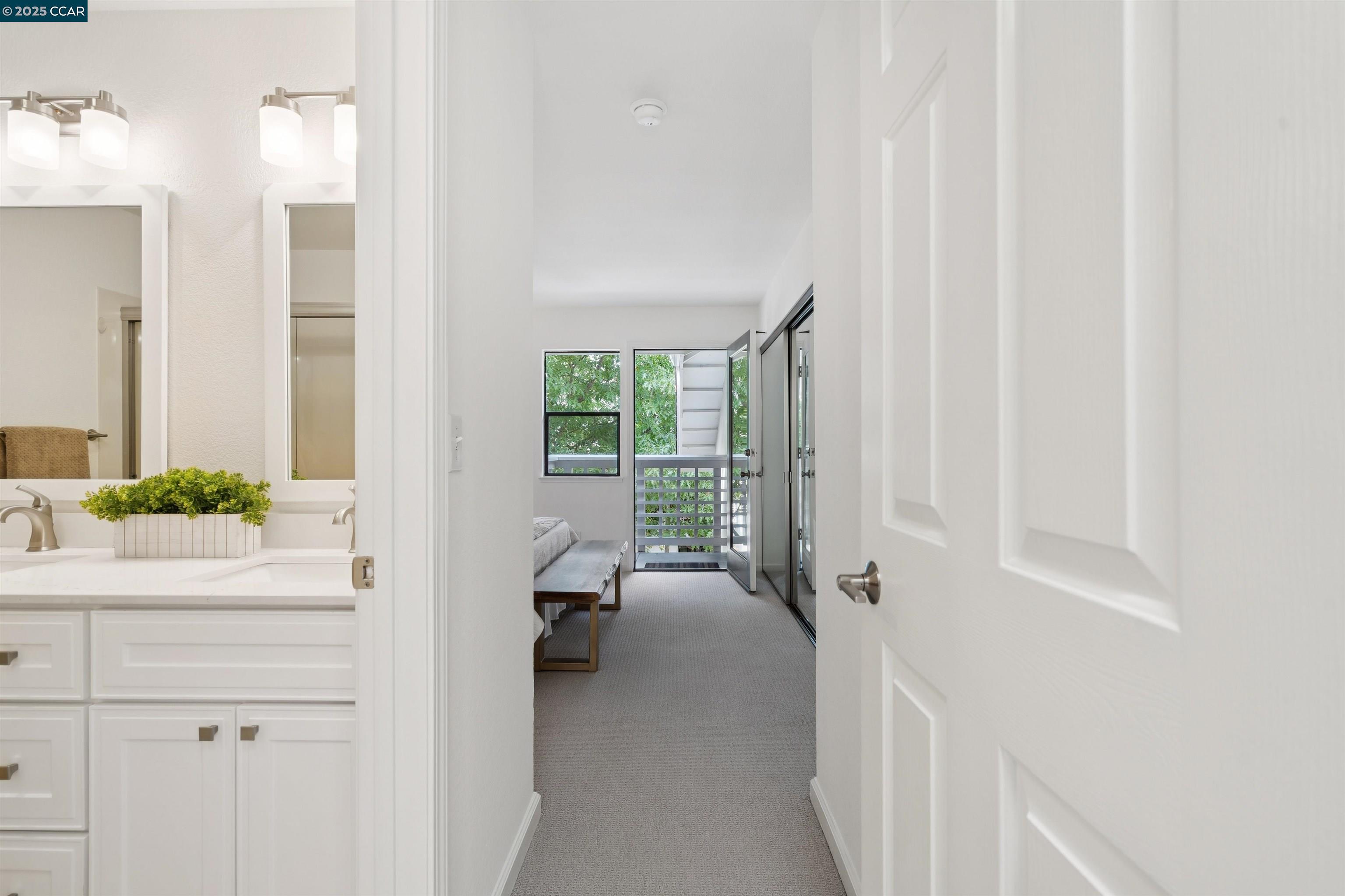 2578 Oak Road, Unit 212 Walnut Creek, CA 94597 - Photo 14 of 27 a view of a hallway with a livingroom and a bathroom