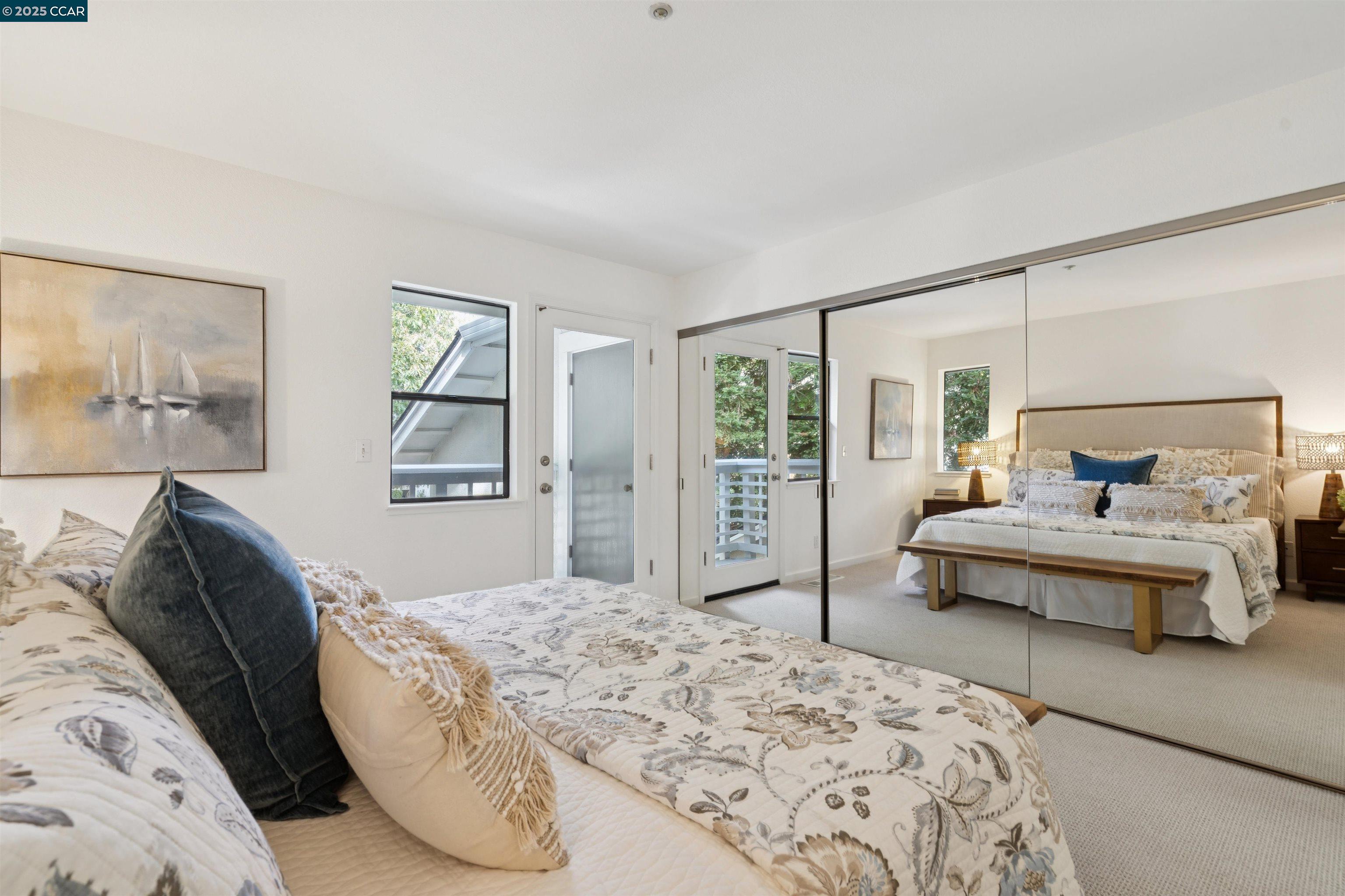 2578 Oak Road, Unit 212 Walnut Creek, CA 94597 - Photo 17 of 27 a bedroom with a large bed and a window