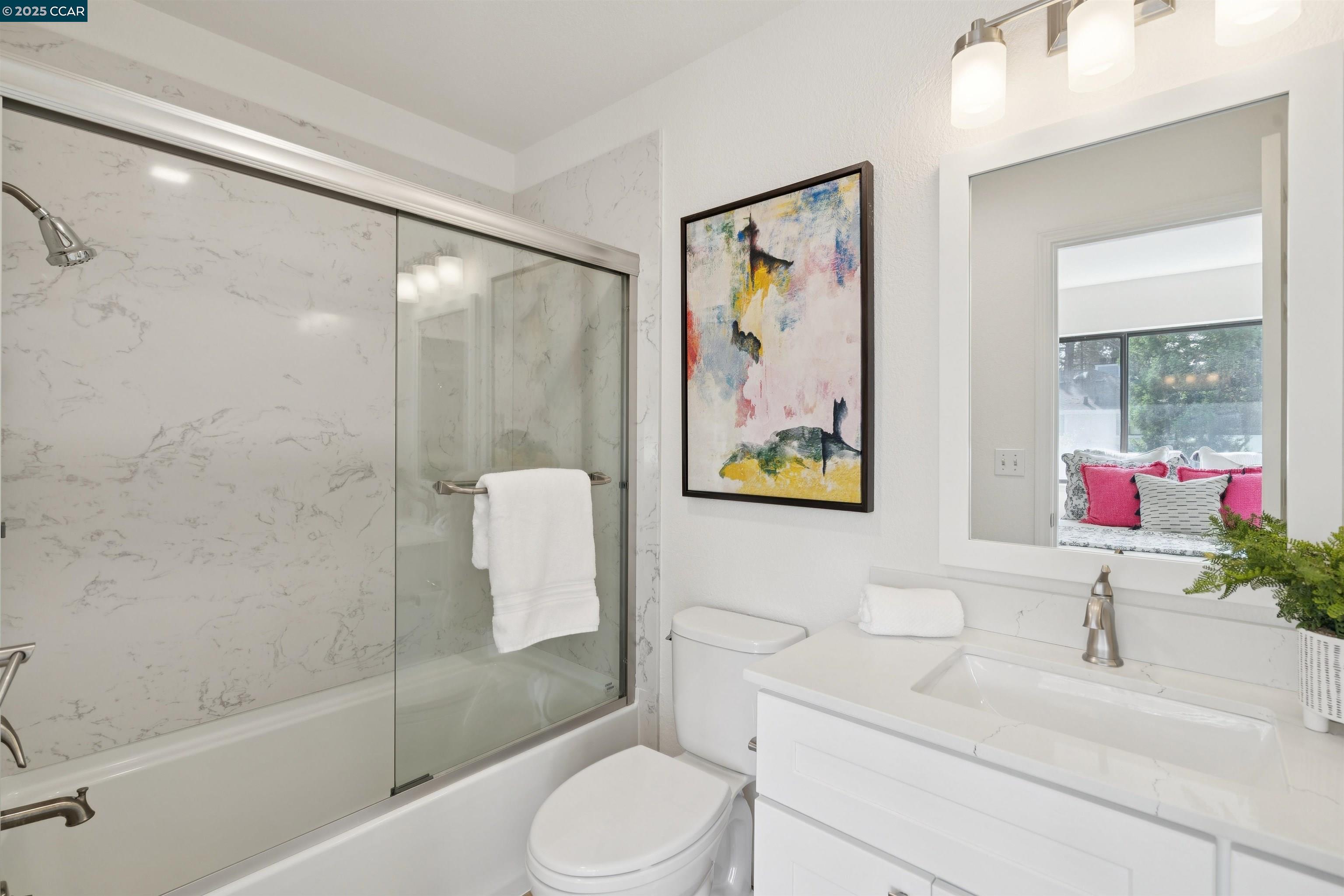 2578 Oak Road, Unit 212 Walnut Creek, CA 94597 - Photo 21 of 27 a bathroom with a sink toilet and shower