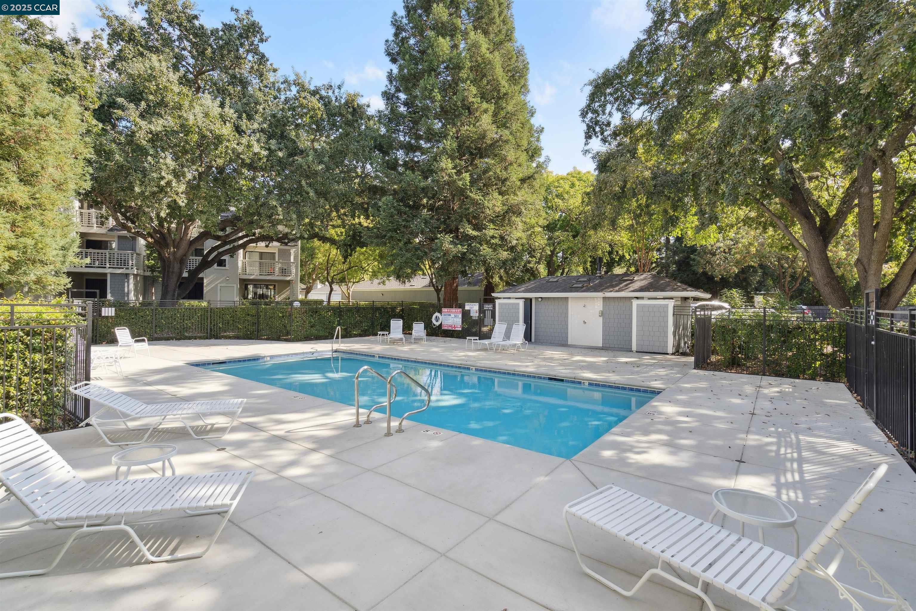 2578 Oak Road, Unit 212 Walnut Creek, CA 94597 - Photo 24 of 27 a view of a yard with plants and trees