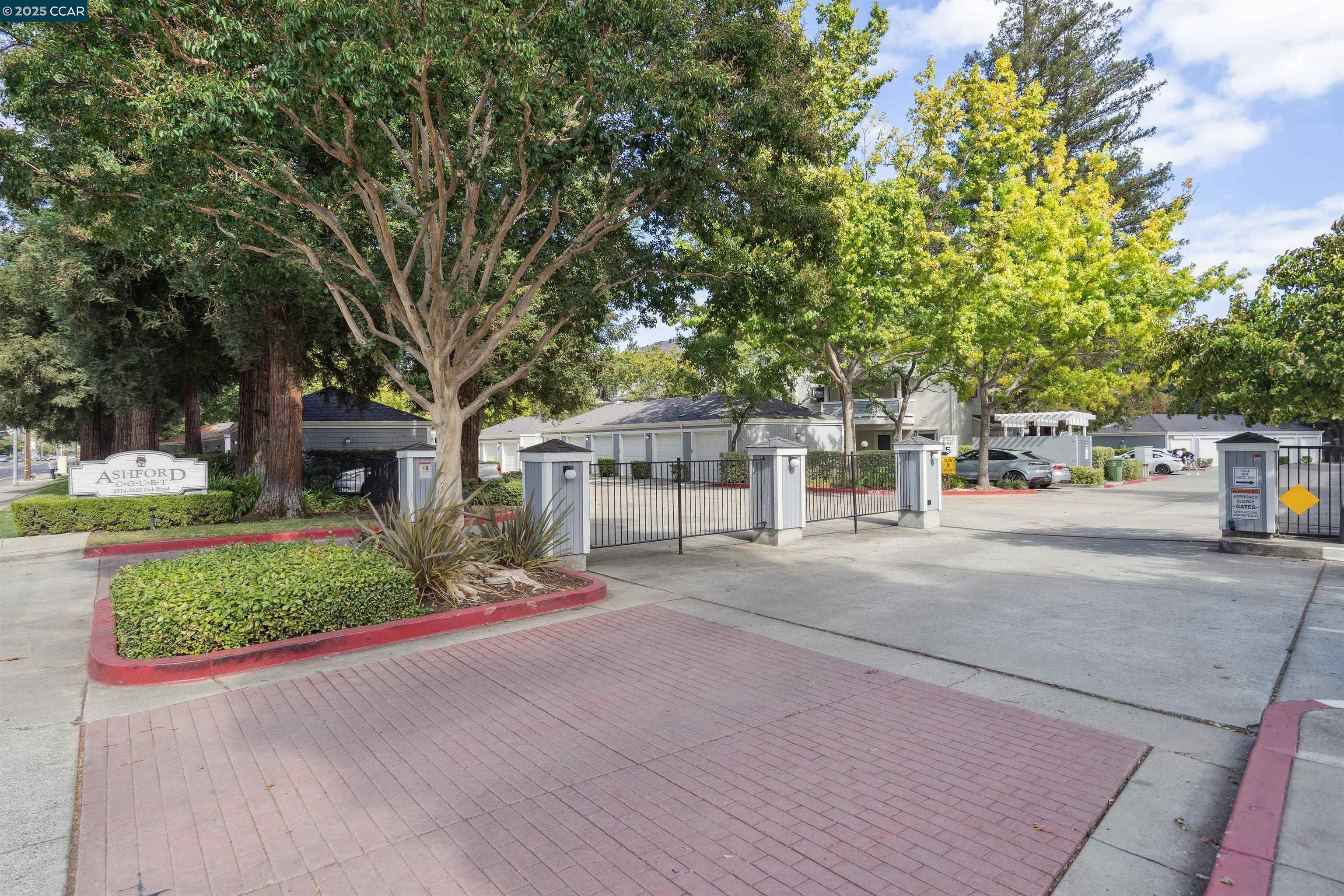 2578 Oak Road, Unit 212 Walnut Creek, CA 94597 - Photo 26 of 27 a view of road with large trees