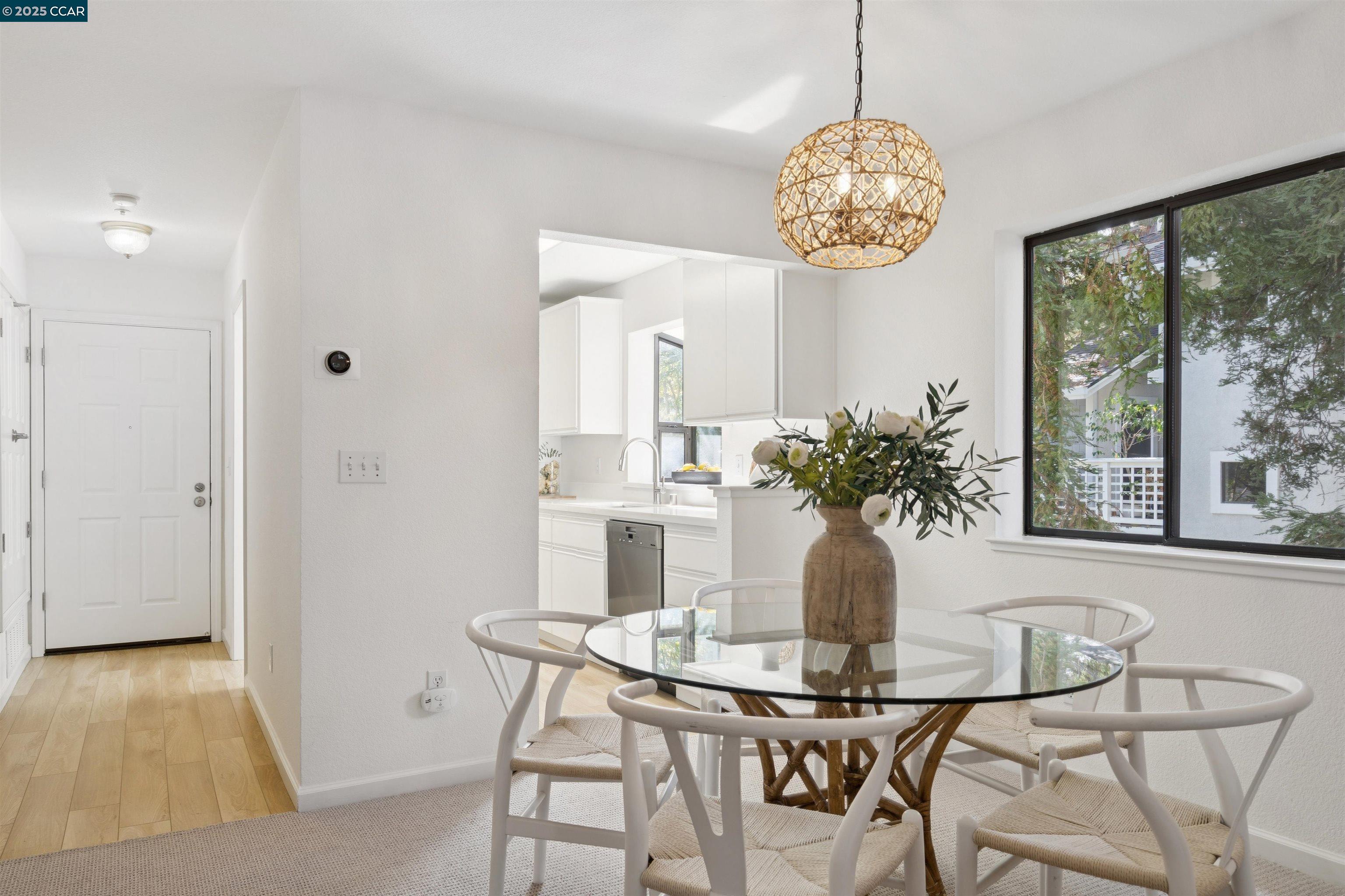 2578 Oak Road, Unit 212 Walnut Creek, CA 94597 - Photo 3 of 27 a view of a dining room with furniture window and outside view