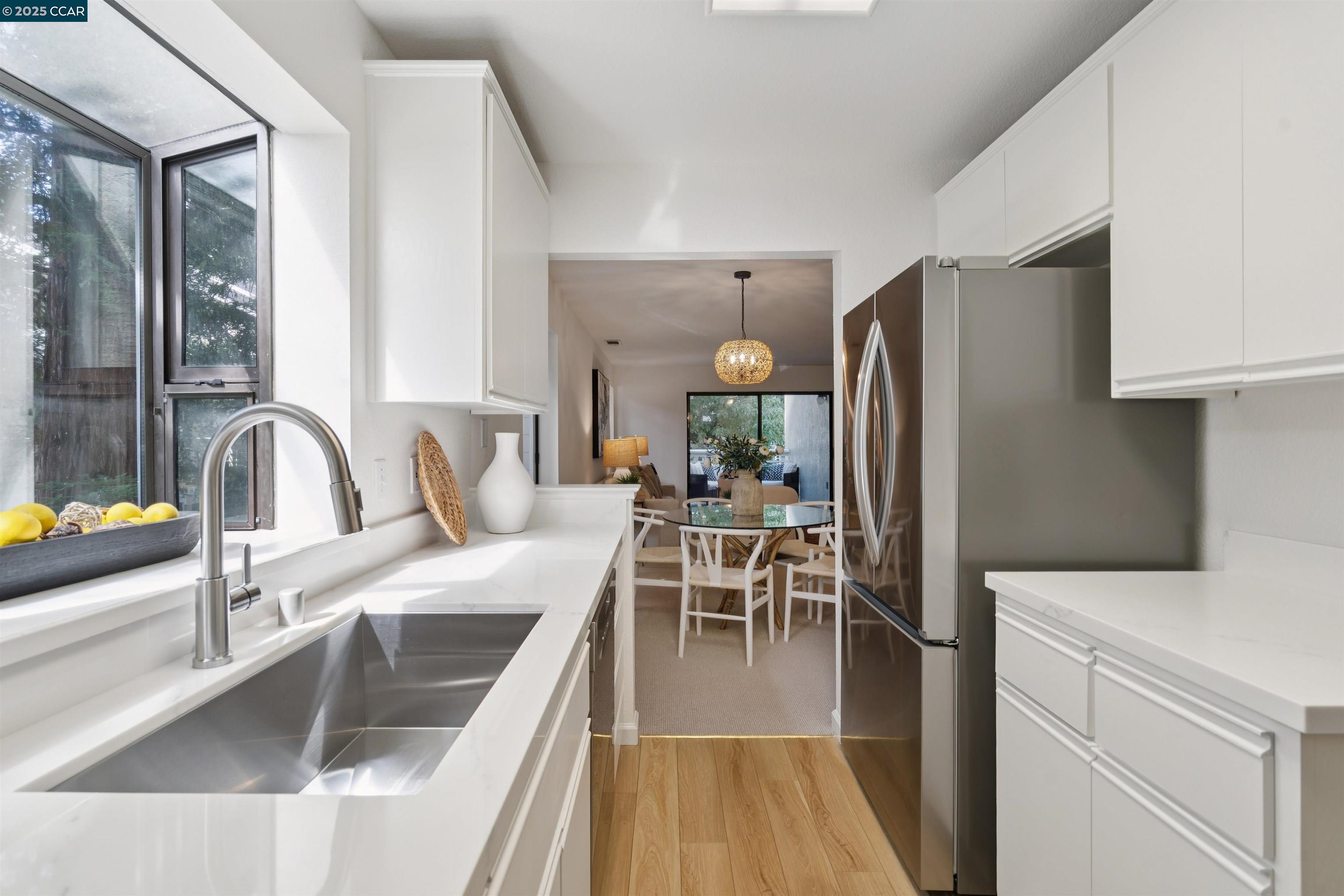 2578 Oak Road, Unit 212 Walnut Creek, CA 94597 - Photo 6 of 27 a kitchen with stainless steel appliances granite countertop a sink a stove and a refrigerator