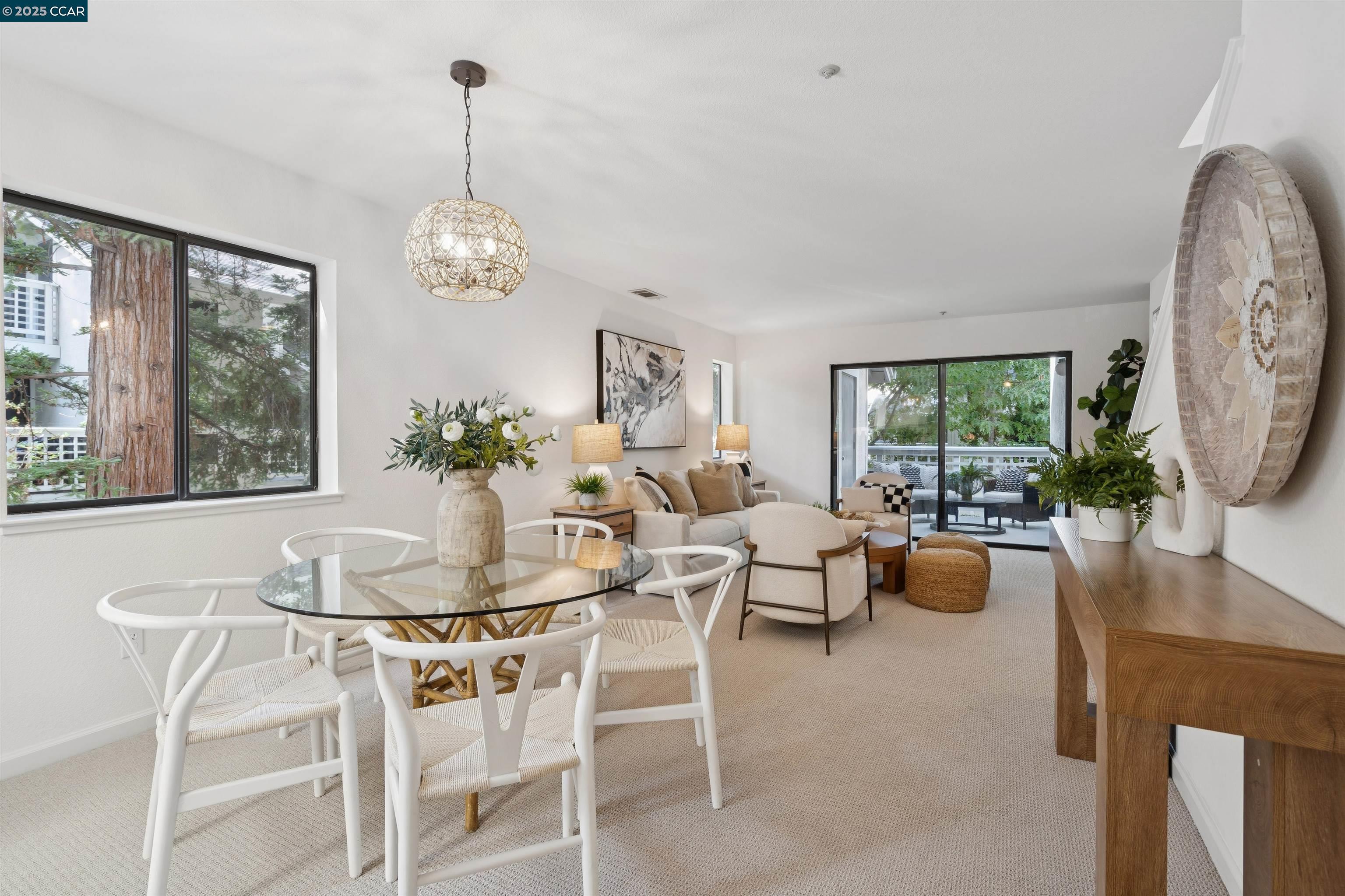 2578 Oak Road, Unit 212 Walnut Creek, CA 94597 - Photo 8 of 27 a dining room with furniture a chandelier and window