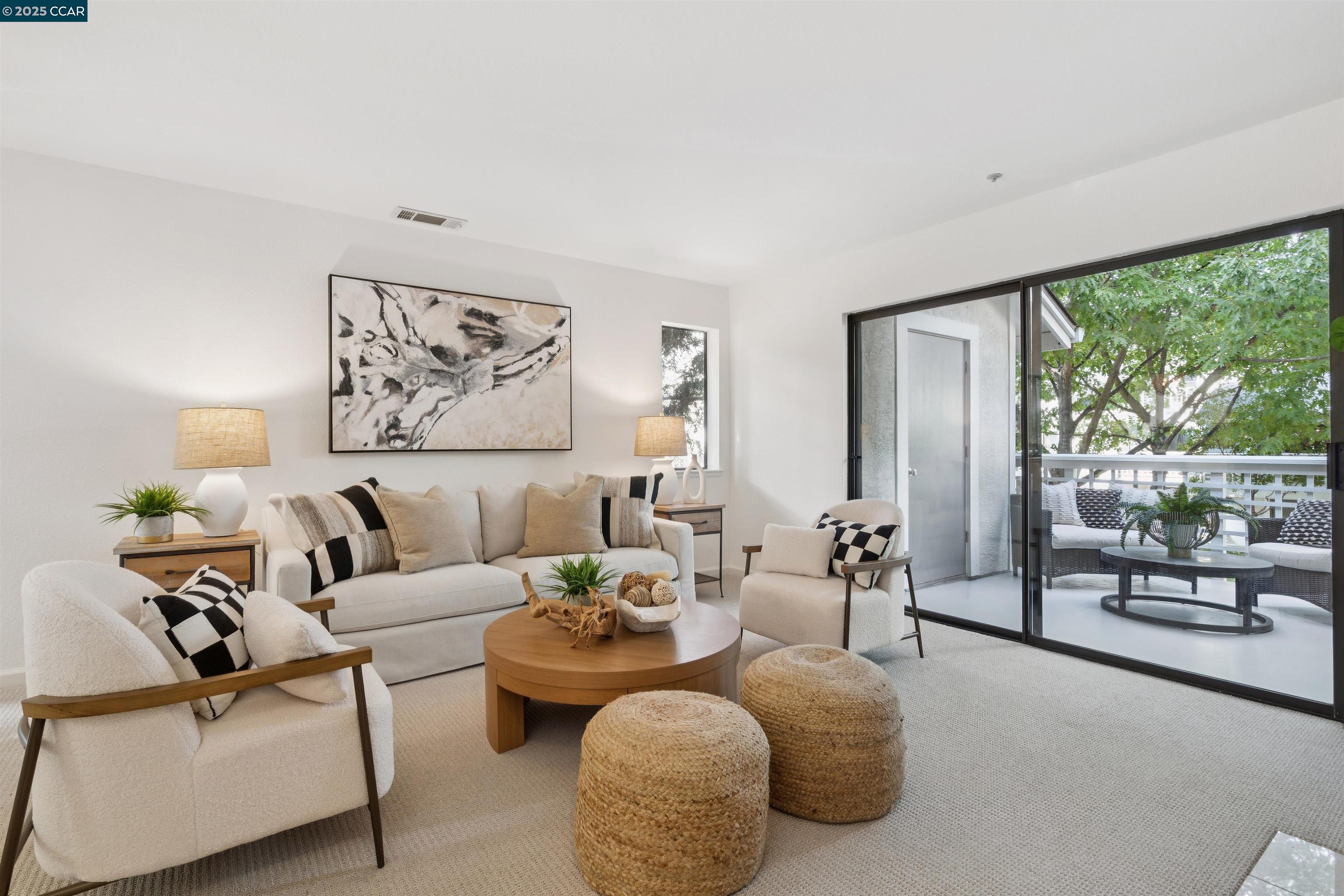 2578 Oak Road, Unit 212 Walnut Creek, CA 94597 - Photo 9 of 27 a living room with furniture and a large window