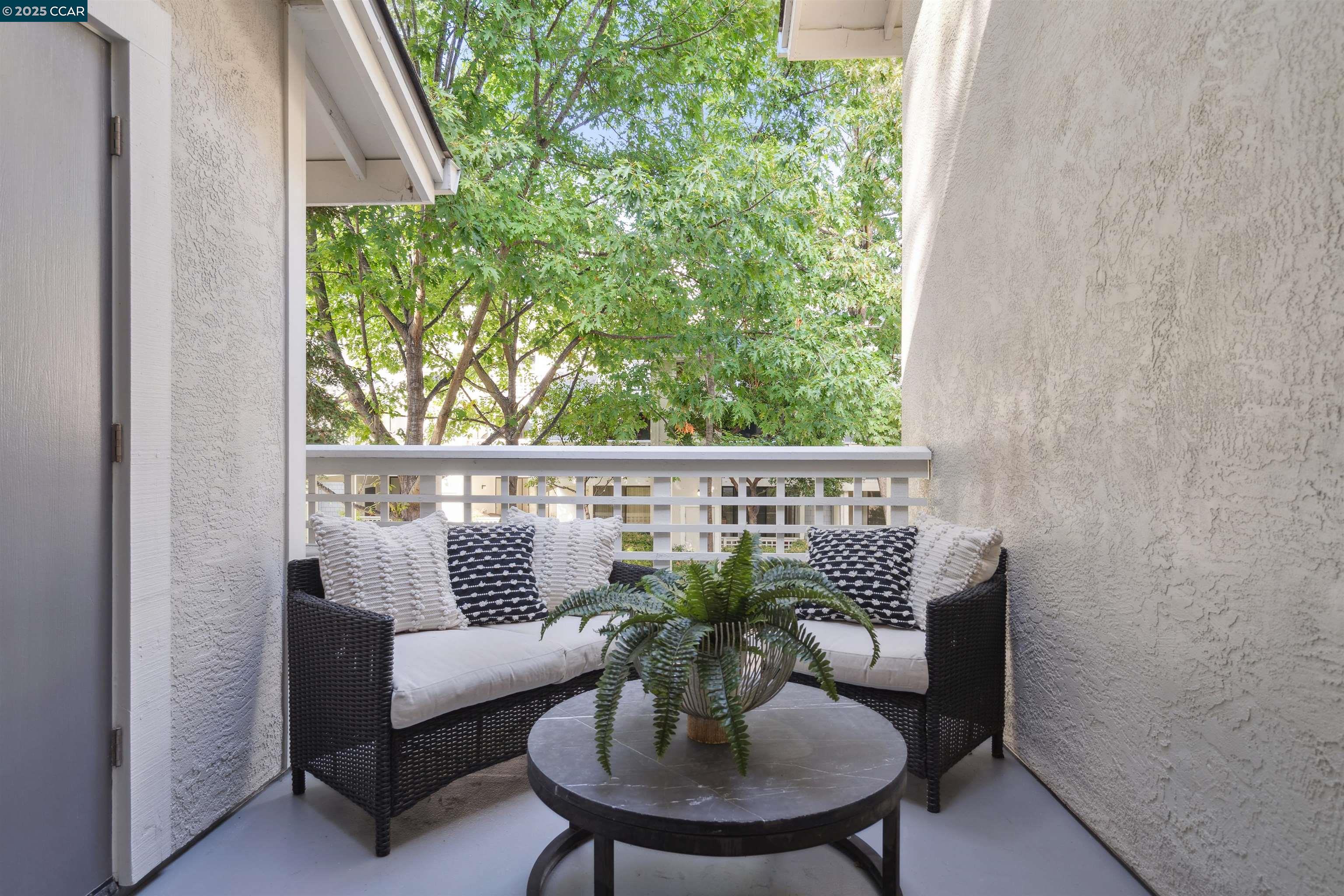 2578 Oak Road, Unit 212 Walnut Creek, CA 94597 - Photo 10 of 27 a view of a chair and table in the balcony