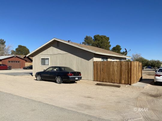 213 South Valley Street Ridgecrest, CA 93555 - Photo 5 of 8 a view of a car parked in front of a house