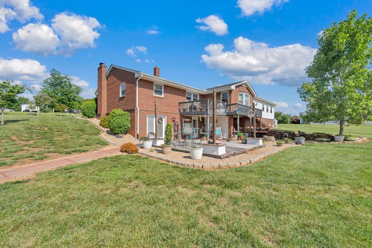 3226 Rakes Road Rocky Mount, VA 24151 - Photo 64 of 74 a view of a house with a yard porch and sitting area