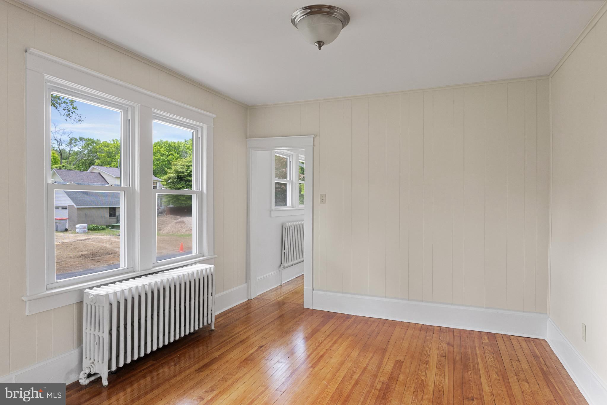 1842 South Spring Road Vineland, NJ 08361 - Photo 11 of 22 a view of an empty room with wooden floor and a window