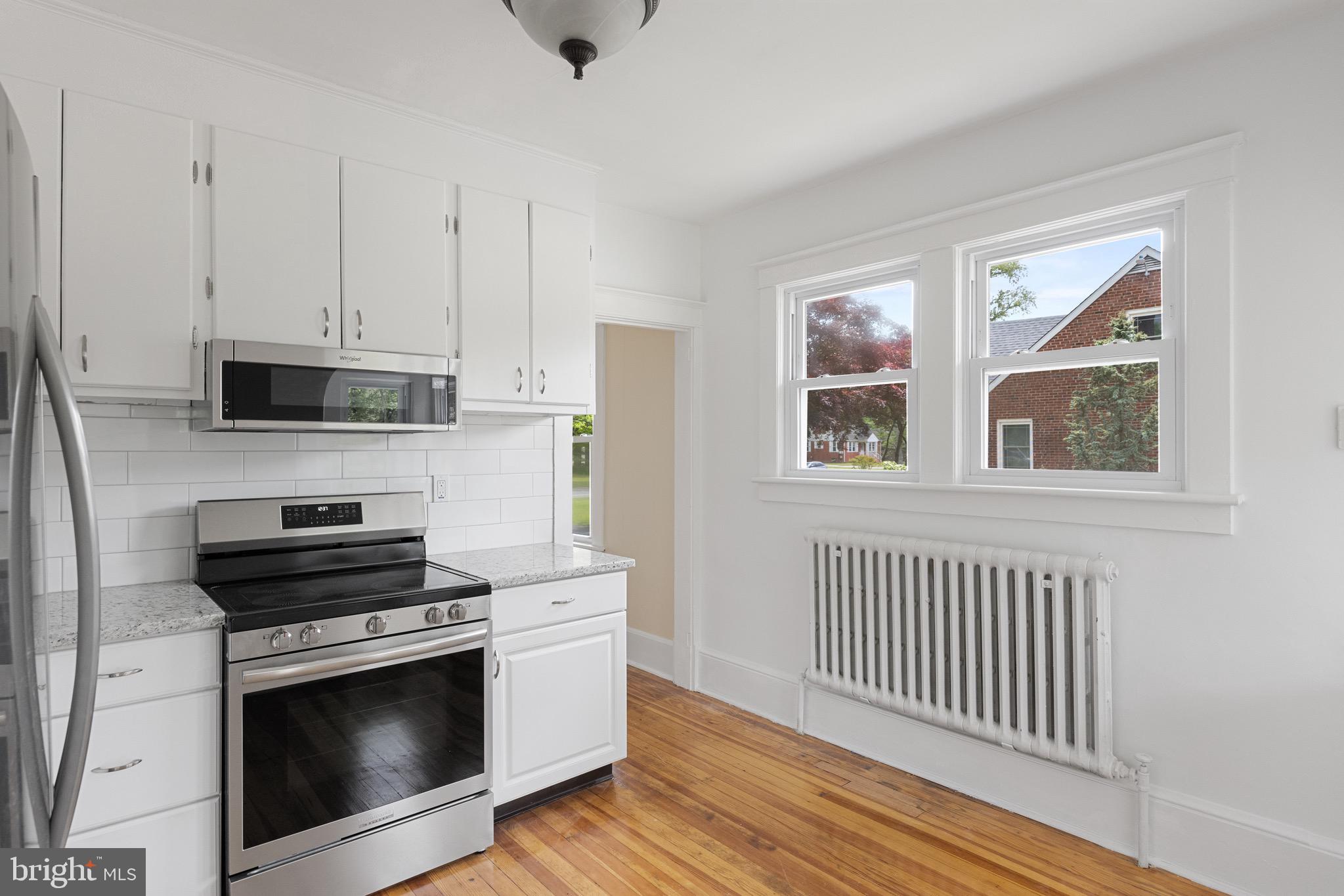 1842 South Spring Road Vineland, NJ 08361 - Photo 16 of 22 a kitchen with stainless steel appliances a stove a microwave and cabinets