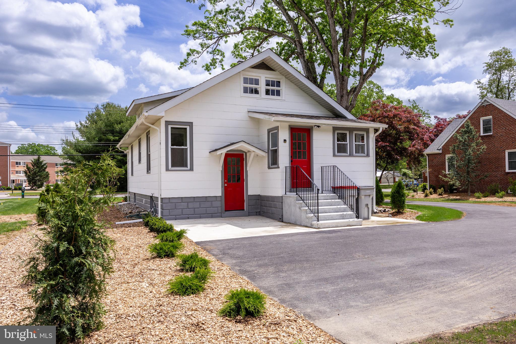 1842 South Spring Road Vineland, NJ 08361 - Photo 5 of 22 a front view of a house with a yard and potted plants