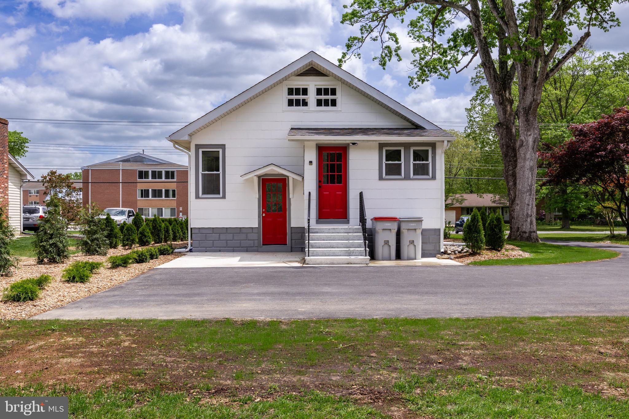 1842 South Spring Road Vineland, NJ 08361 - Photo 6 of 22 a front view of a house with a yard and garage