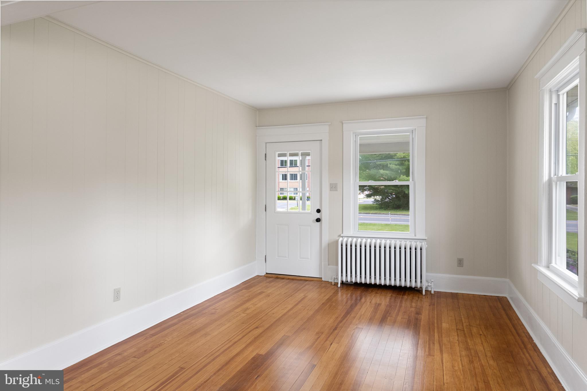 1842 South Spring Road Vineland, NJ 08361 - Photo 10 of 22 an empty room with wooden floor and windows