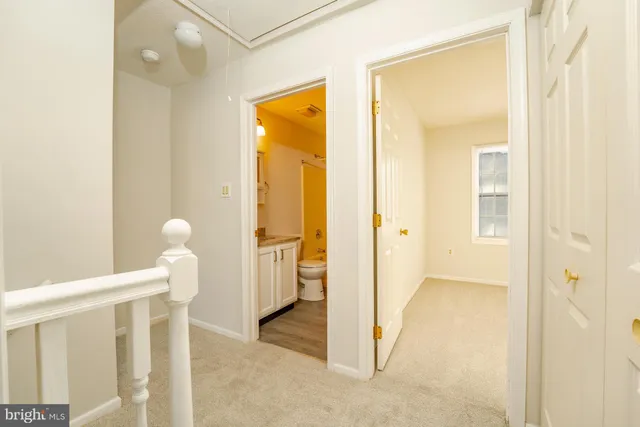 a view of a bathroom from a hallway