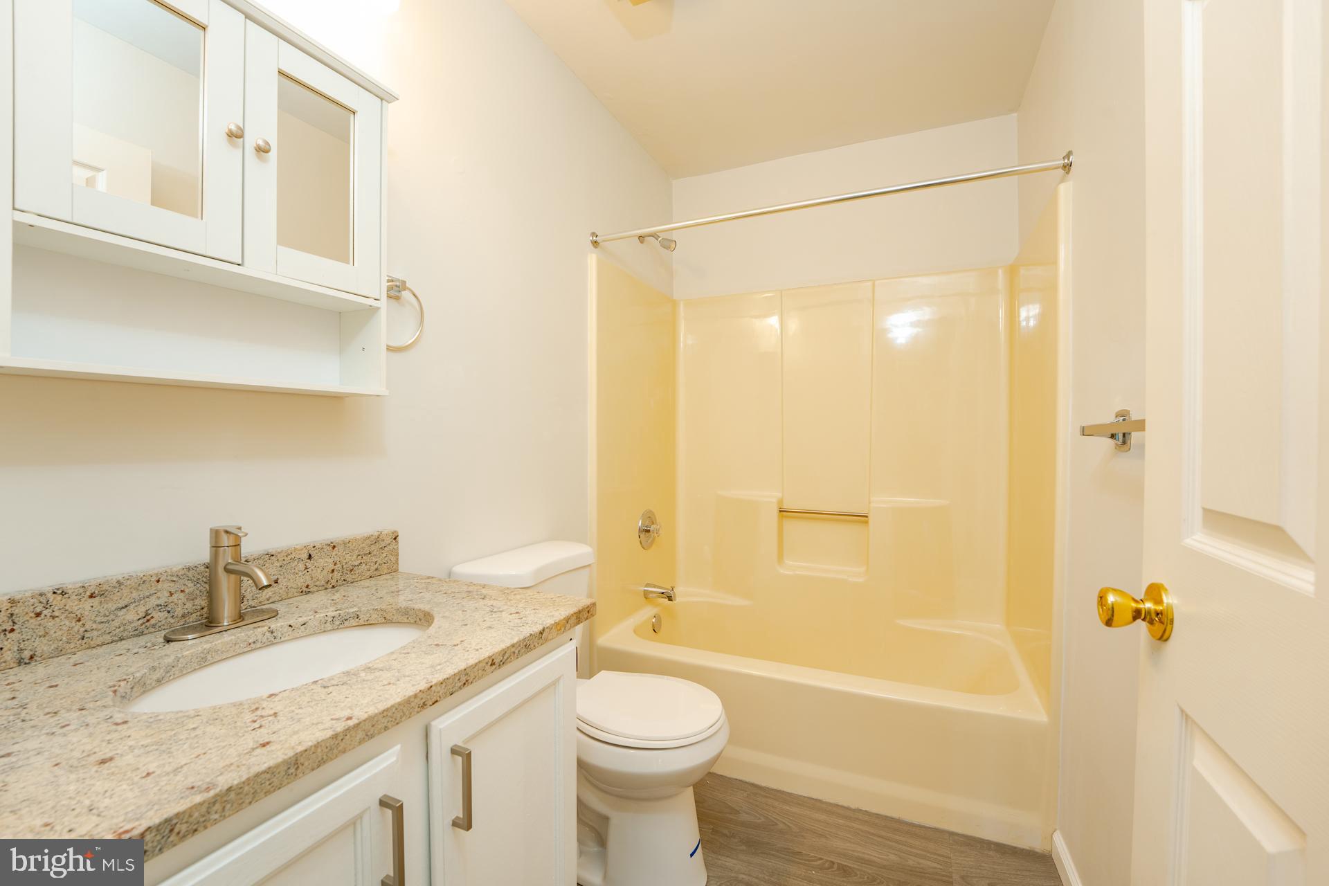 19 Clipper Court Atlantic City, NJ 08401 - Photo 12 of 35 a bathroom with a granite countertop sink toilet and shower