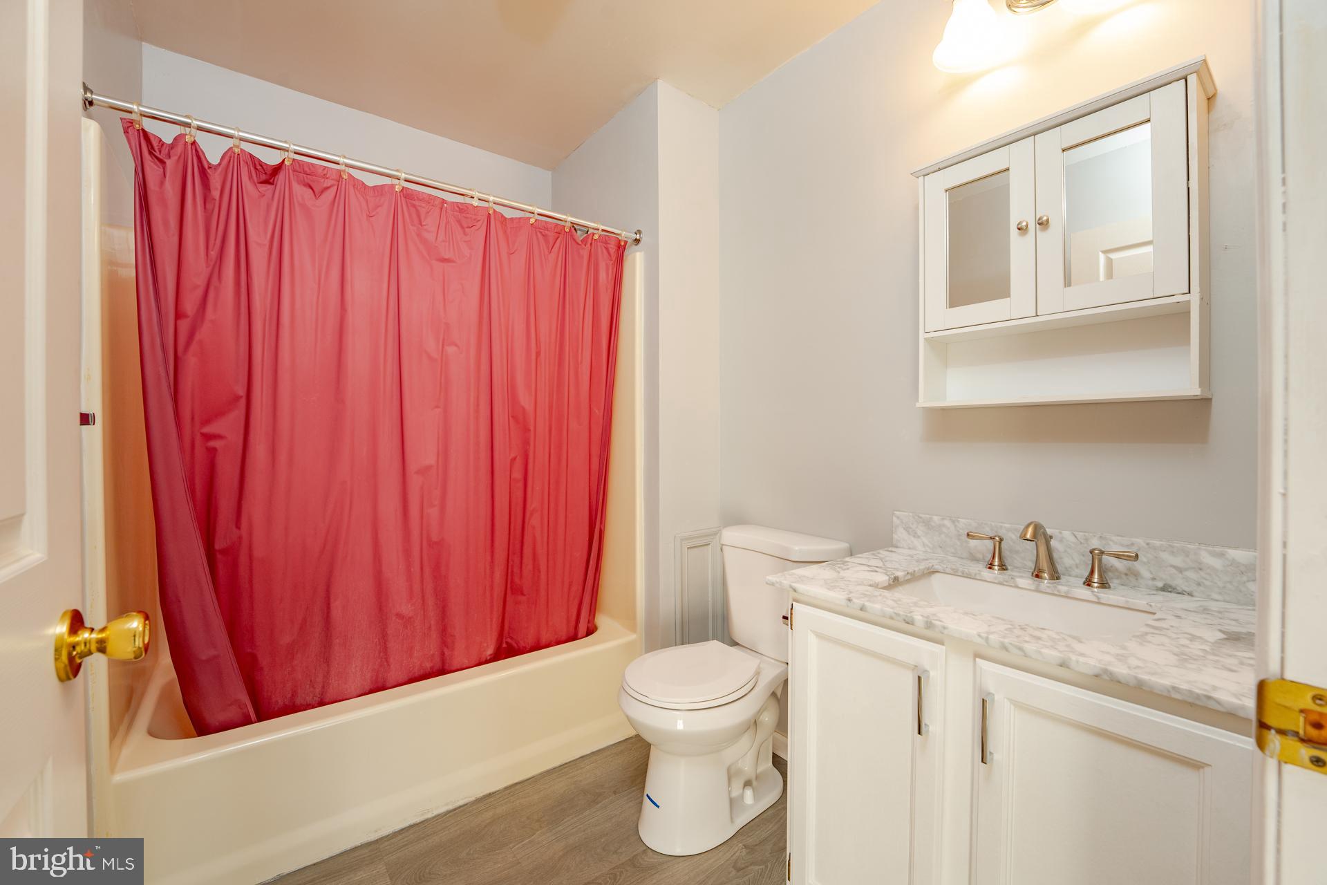 19 Clipper Court Atlantic City, NJ 08401 - Photo 16 of 35 a bathroom with a granite countertop sink and a mirror