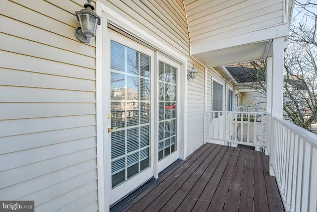 a view of balcony with wooden floor