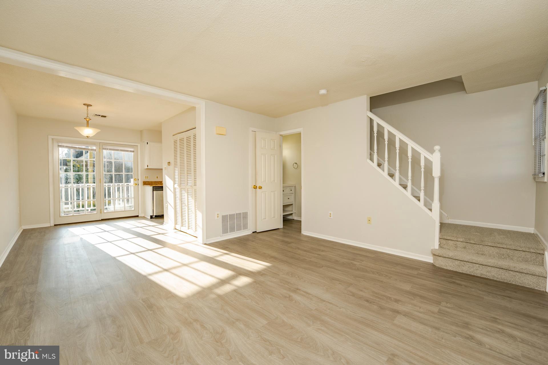 19 Clipper Court Atlantic City, NJ 08401 - Photo 3 of 35 a view of an empty room with wooden floor and a window