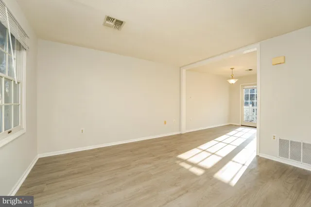 a view of an empty room and window