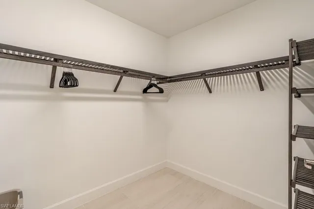a bathroom with a double vanity sink mirror and shower