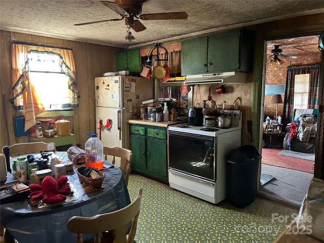 a kitchen with a stove and a refrigerator