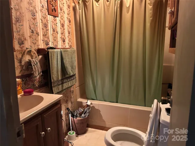 a bath room with a sink and a mirror